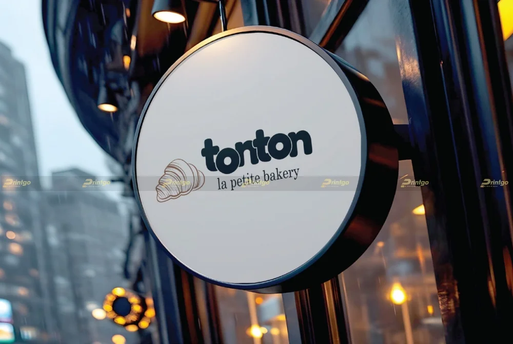 Mockup logo thương hiệu Tonton Bakery trên biển bảng