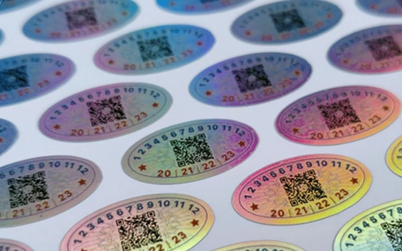 Mẫu tem chống hàng giả Hologram tích hợp QR code/serial Mẫu tem chống hàng giả Hologram tích hợp QR code/serial
