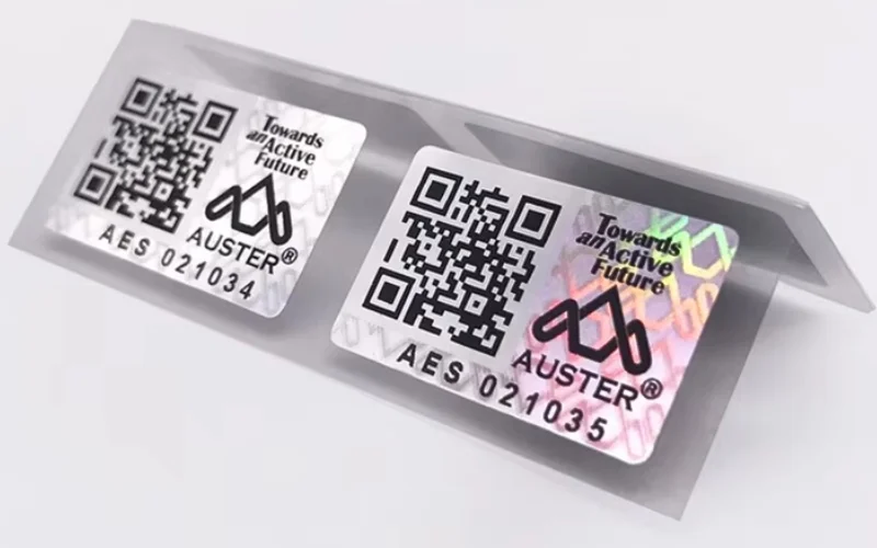 Mẫu tem chống hàng giả Hologram tích hợp QR code/serial Mẫu tem chống hàng giả Hologram tích hợp QR code/serial