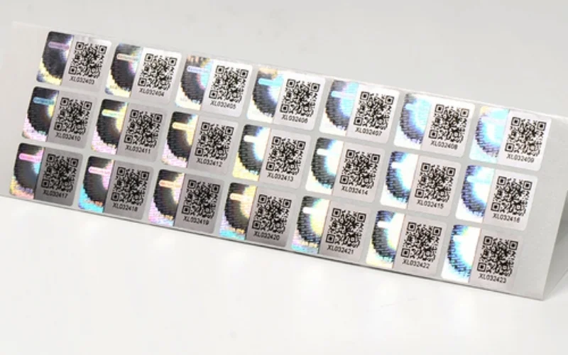 Mẫu tem chống hàng giả Hologram tích hợp QR code/serial Mẫu tem chống hàng giả Hologram tích hợp QR code/serial