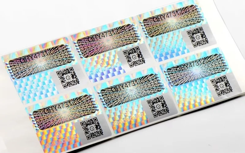 Mẫu tem chống hàng giả Hologram tích hợp QR code/serial Mẫu tem chống hàng giả Hologram tích hợp QR code/serial