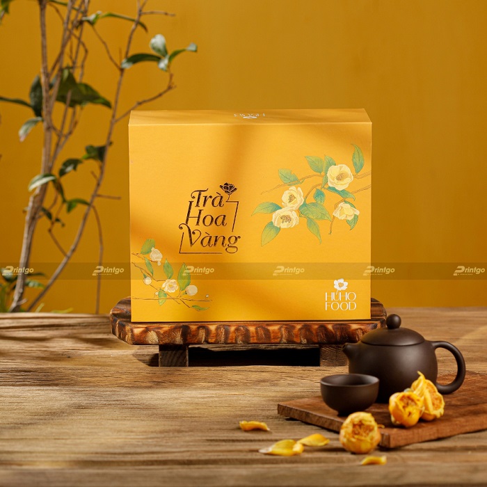 Thiết kế hộp trà hoa vàng của thương hiệu Huho Food