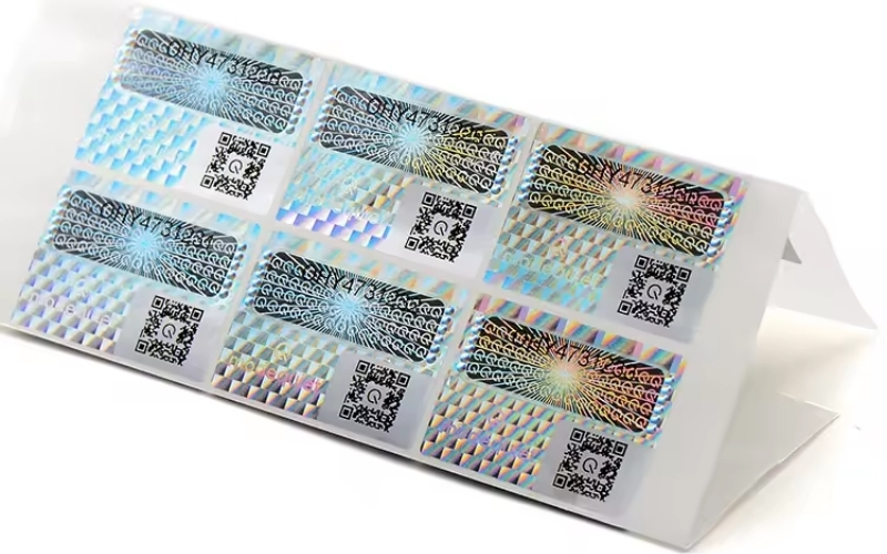 Mẫu tem chống hàng giả Hologram tích hợp QR code/serial Mẫu tem chống hàng giả Hologram tích hợp QR code/serial