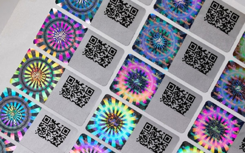 Mẫu tem chống hàng giả Hologram tích hợp QR code/serial Mẫu tem chống hàng giả Hologram tích hợp QR code/serial